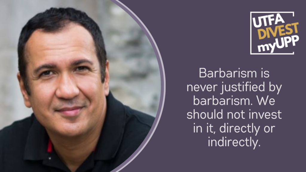 Headshot of a professor with short dark brown hair and eyes, looking into the camera and smiling confidently.