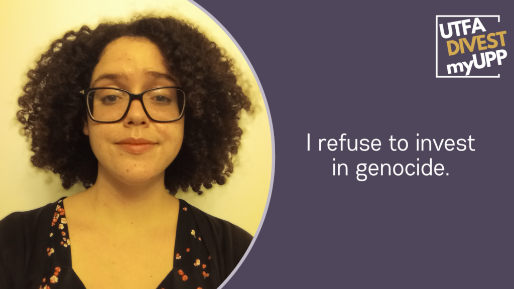Picture of a woman in her 30s with shoulder-length kinky-curly black hair and square-framed glasses with a mild expression.