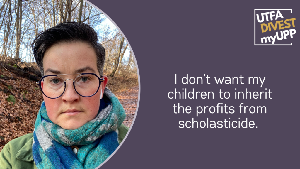 Picture of a white nonbinary person with glasses and dark hair wearing a scarf and a green jacket, with airpods in their ears. They are looking at the camera, with a neutral expression. They are in a wooded area.