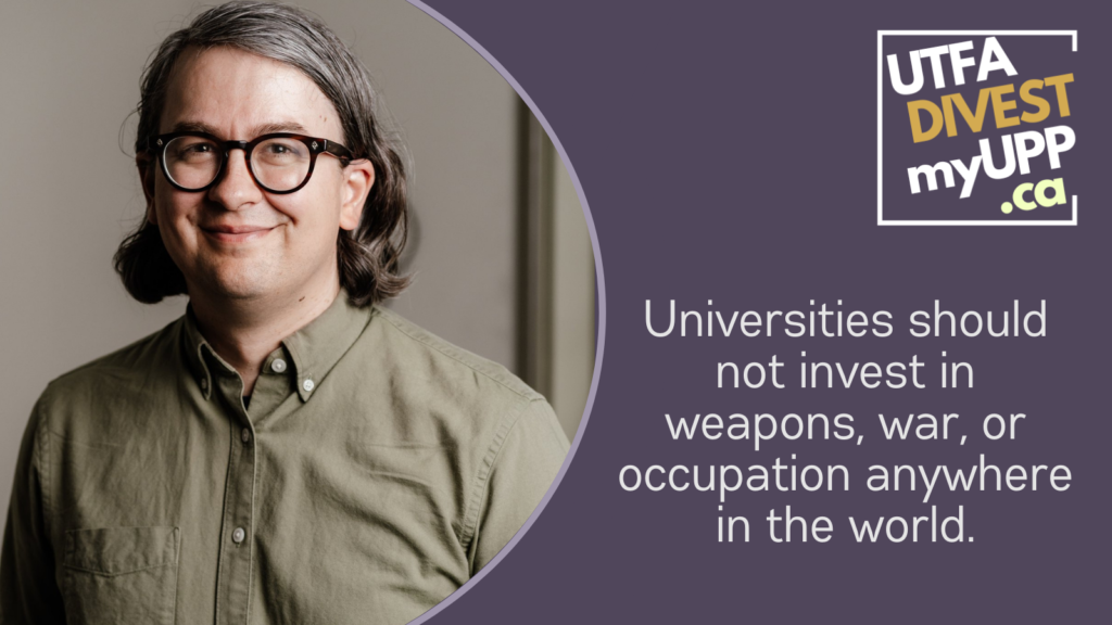 Picture of a white 40-year-old man with longish grey-brown hair and thick-rimmed glasses, wearing an olive green collared shirt against a neutral background.