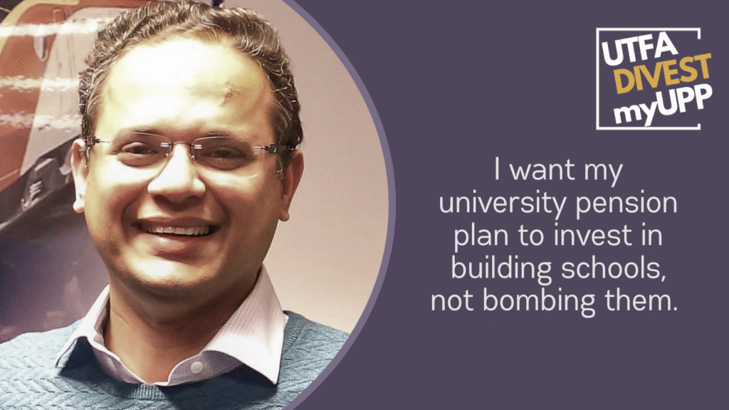 Professor with collared shirt and sweater, glasses and a big smile.